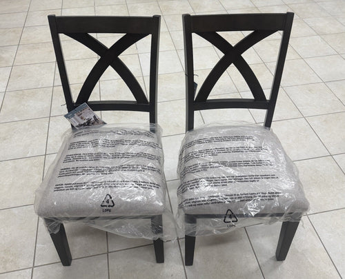 Two actual upholstered cross-back chairs from the Bayside Westen dining set